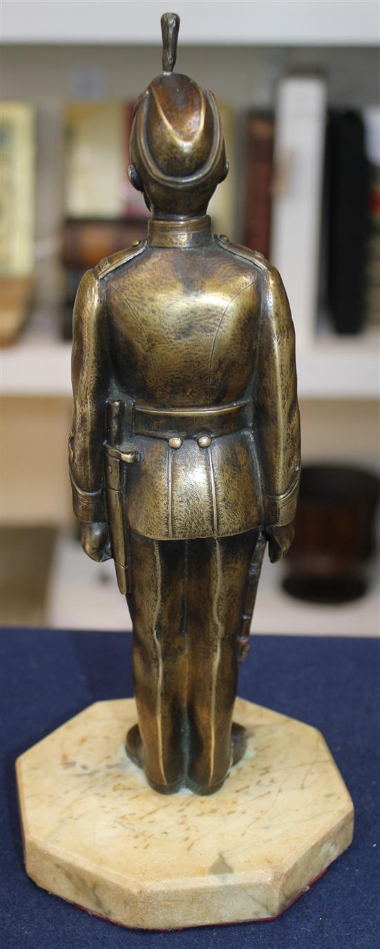 An early 20th century patinated military bronze model of a Kings Royal Rifle Corps soldier, 10.5in.